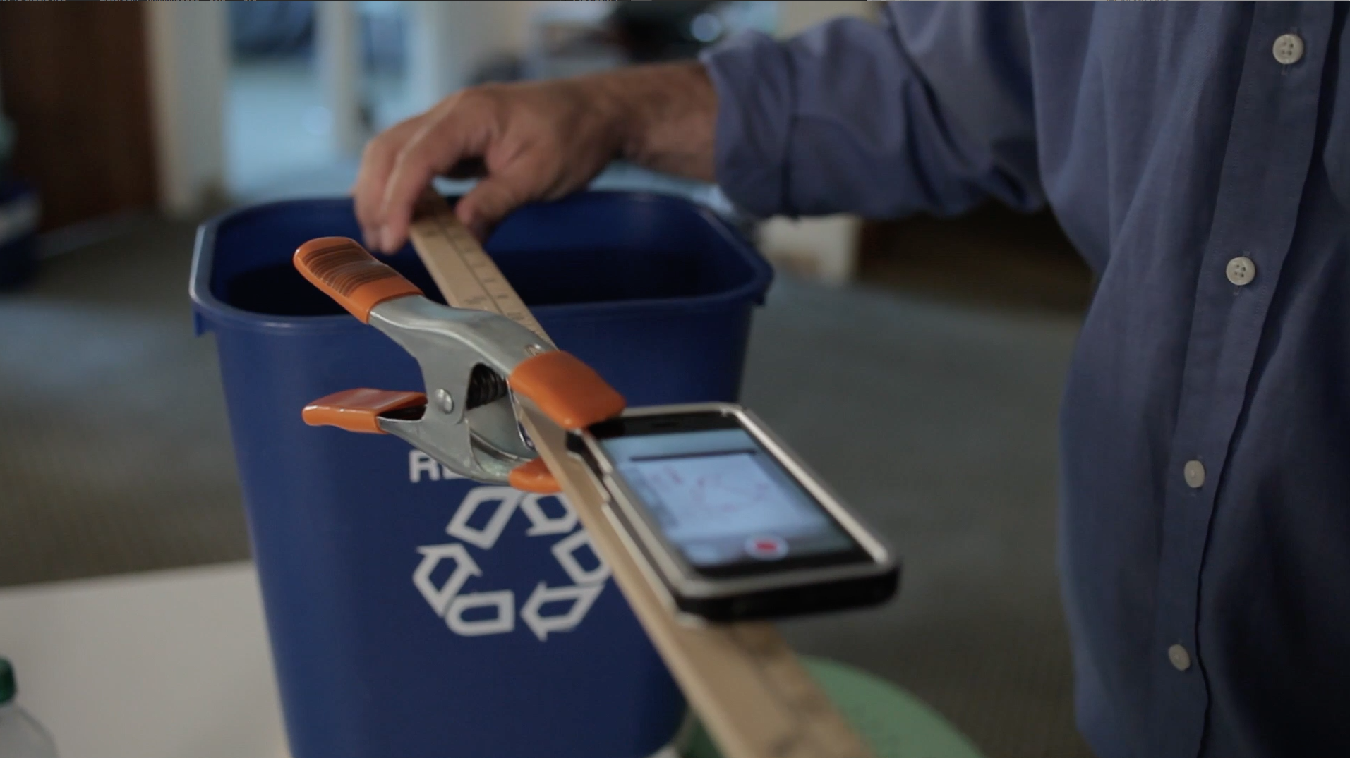 Like the early experiment shown in this image, the simplest overhead camera set up might include only a smartphone affixed to a yardstick (or similar support), suspended above your desk by whatever means are available: a trashcan, a few stacks of books.